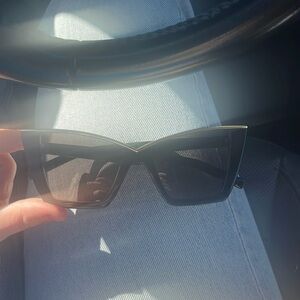 black ysl glasses with gold trim. they retail at $520 & are in great condition.